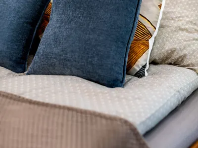 Close view of the double bed and cushions at Doma Budapest
