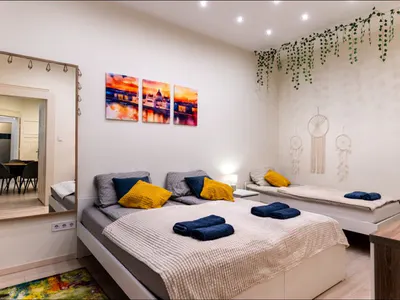 Bedroom with three single beds at Doma Budapest
