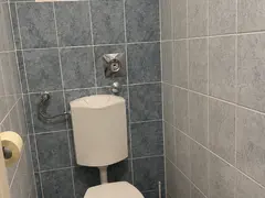 Separate WC with blue tiling at Doma Budapest