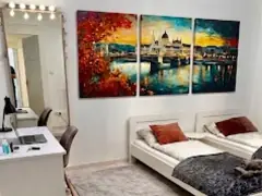 Bedroom with desk and wall art