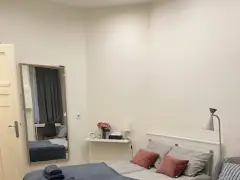 Bedroom with grey bedding