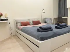 Bedroom with desk and seating